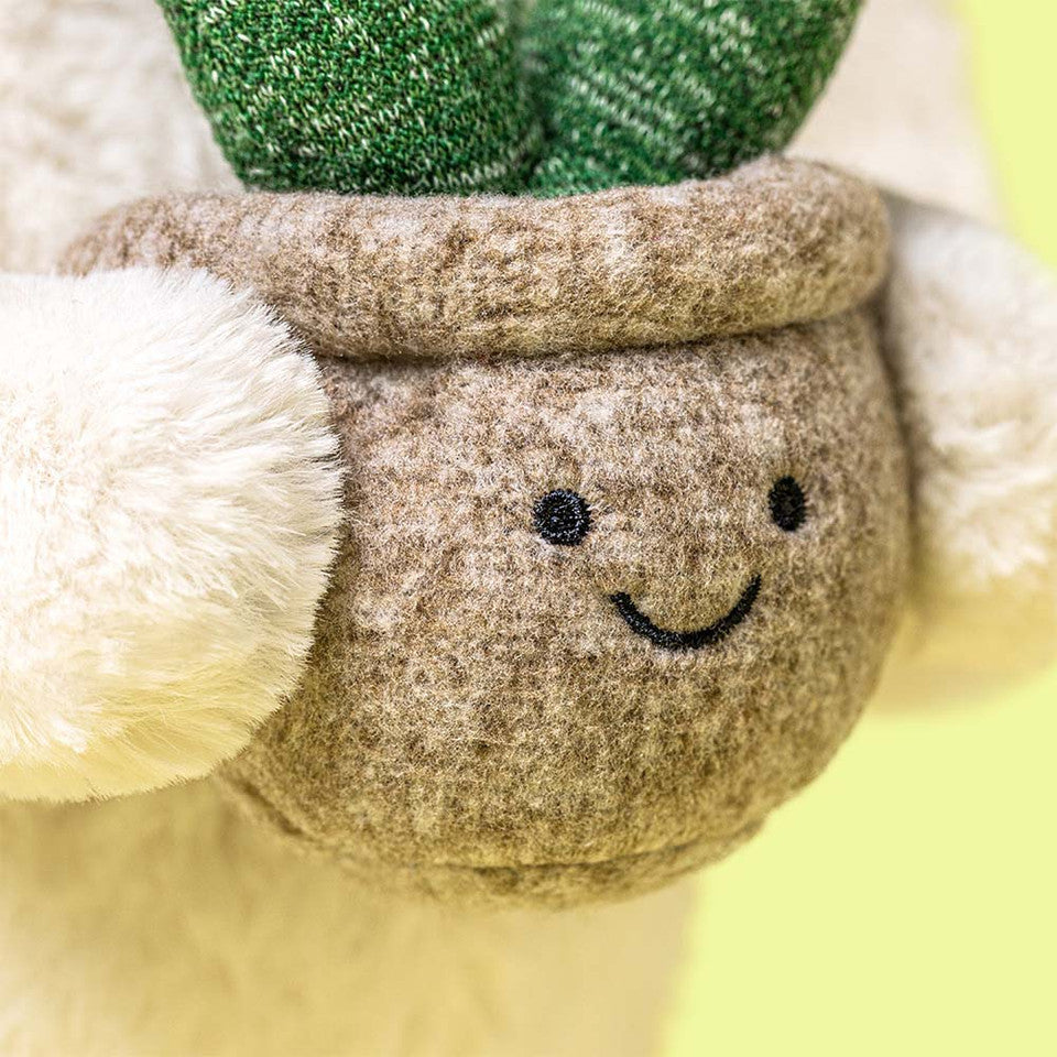 Jellycat bunny holding a plant