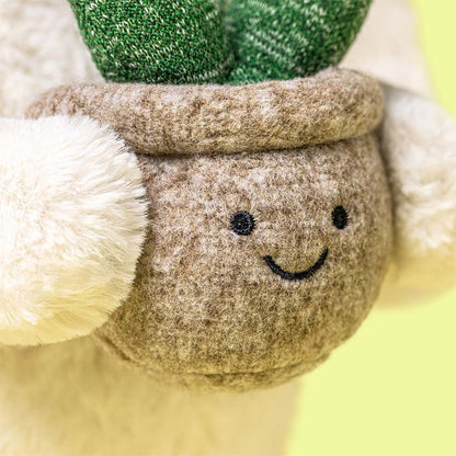 Jellycat bunny holding a plant