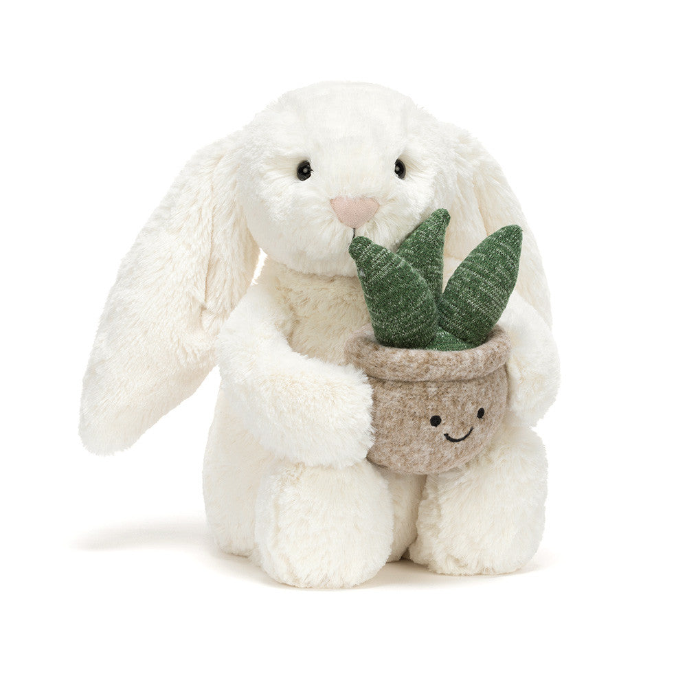 Jellycat bunny holding a plant