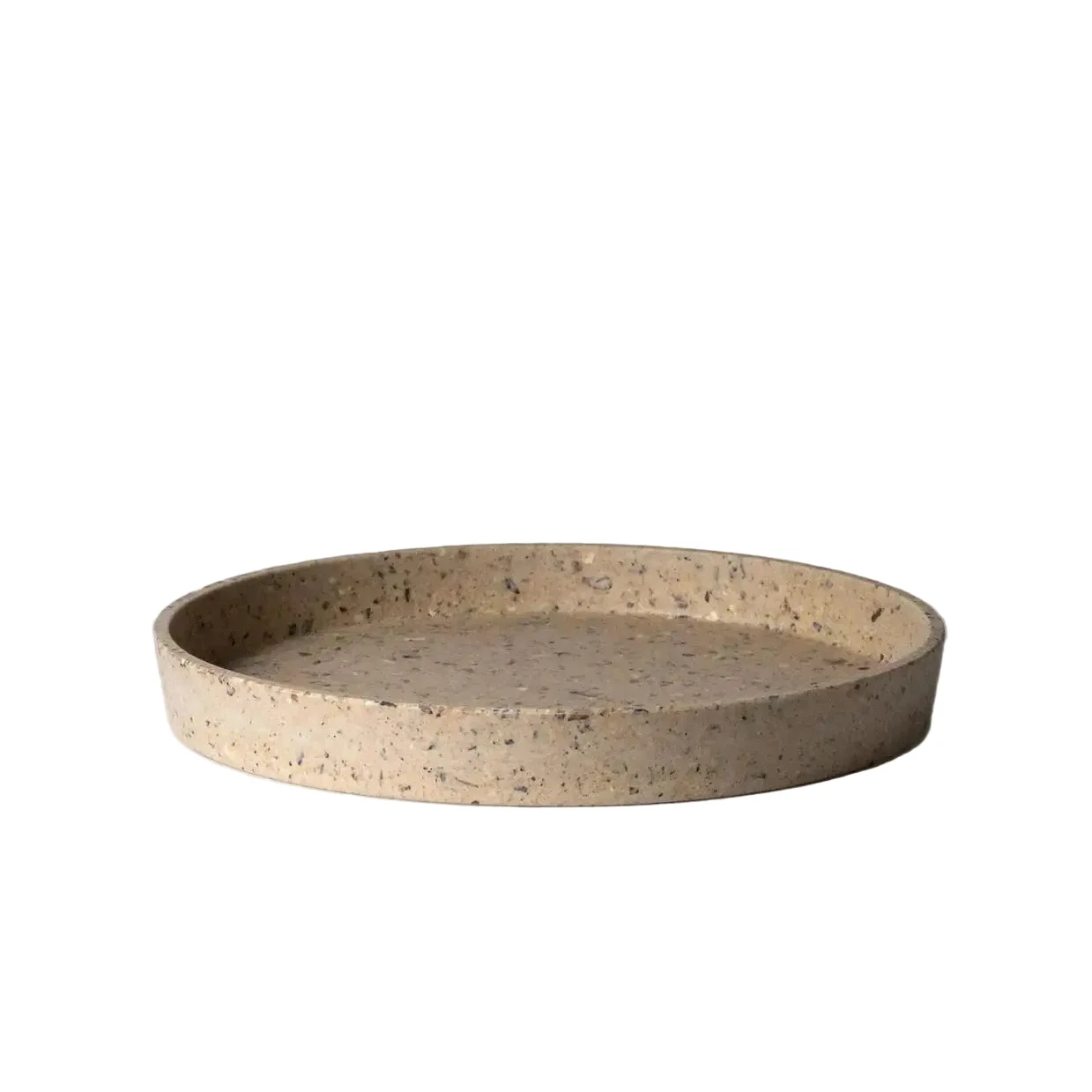 Round coffee bean husk tray on a light gray background
