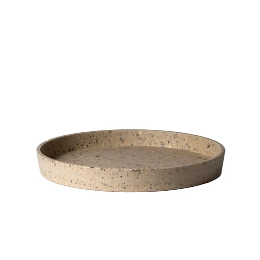 Round coffee bean husk tray on a light gray background
