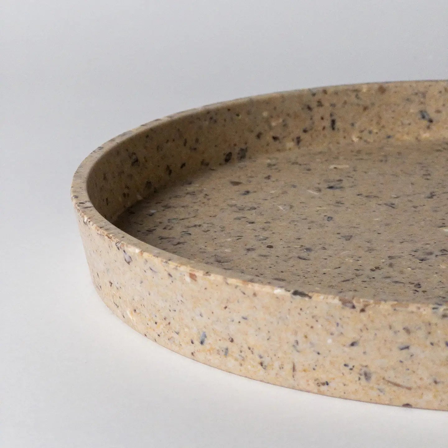 Round coffee bean husk tray on a light gray background by kinso designs