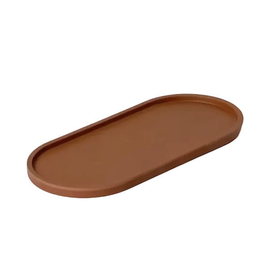 Terracotta-coloured oval tray on a light gray background