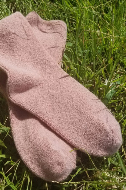 Pink socks on grass