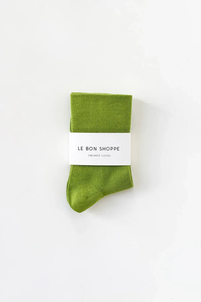 Green sock with a white label on a white background