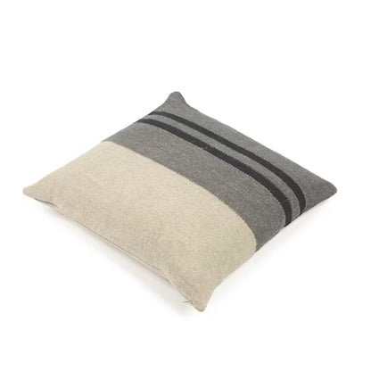 Two-tone pillow with gray and beige stripes on a white background