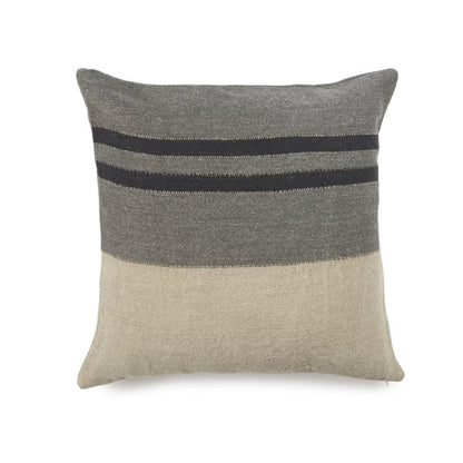 Gray and beige pillow with black stripes on a white background