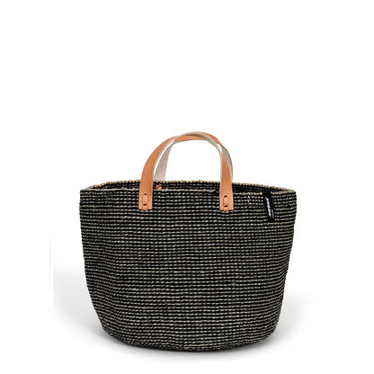 Black woven basket with leather handles on a white background