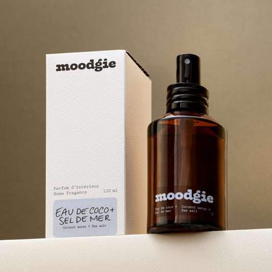 moodgie home fragrance bottle and packaging on a neutral background