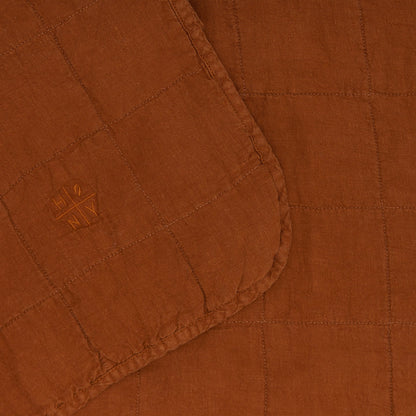 Close up of Simple Linen Quilt in Terracotta By Hawkins New York
