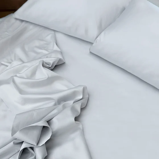 St Geneve porto sateen white sheet set on a bed