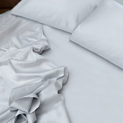 St Geneve porto sateen white sheet set on a bed