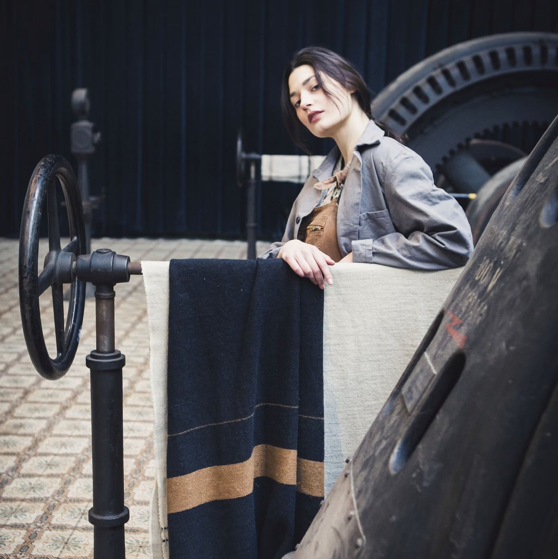 Woman next to Libeco Oscar Linen Wool Throw