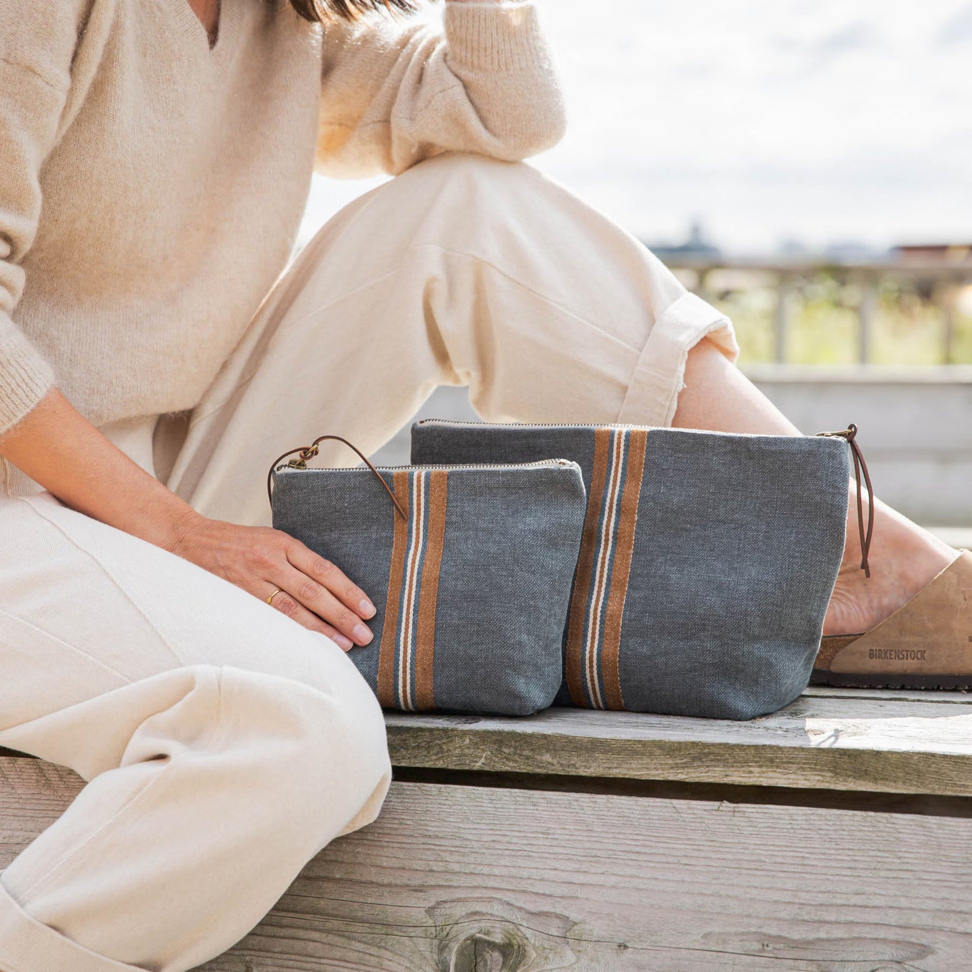 Women next to Libeco Atlas Cosmetic Bag in River