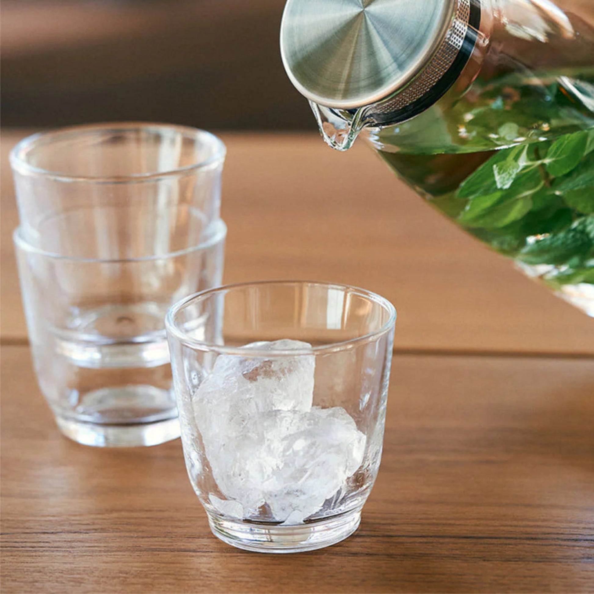 KINTO HIBI Tumblers Clear, 220ml with ice  on wooden table