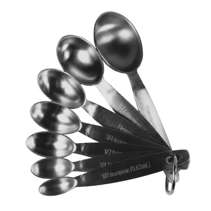 Set of stainless steel measuring spoons with measurements on a white background