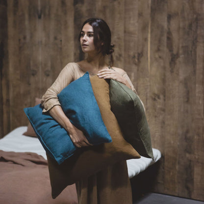 Woman holding Libeco Hudson Pillows