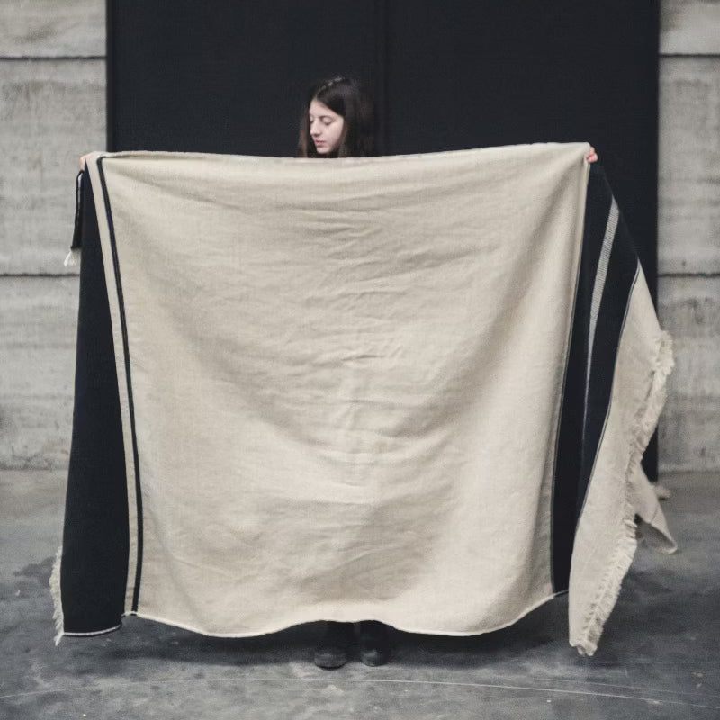 Woman holding Libeco Marshall Throw in Multi-Stripe