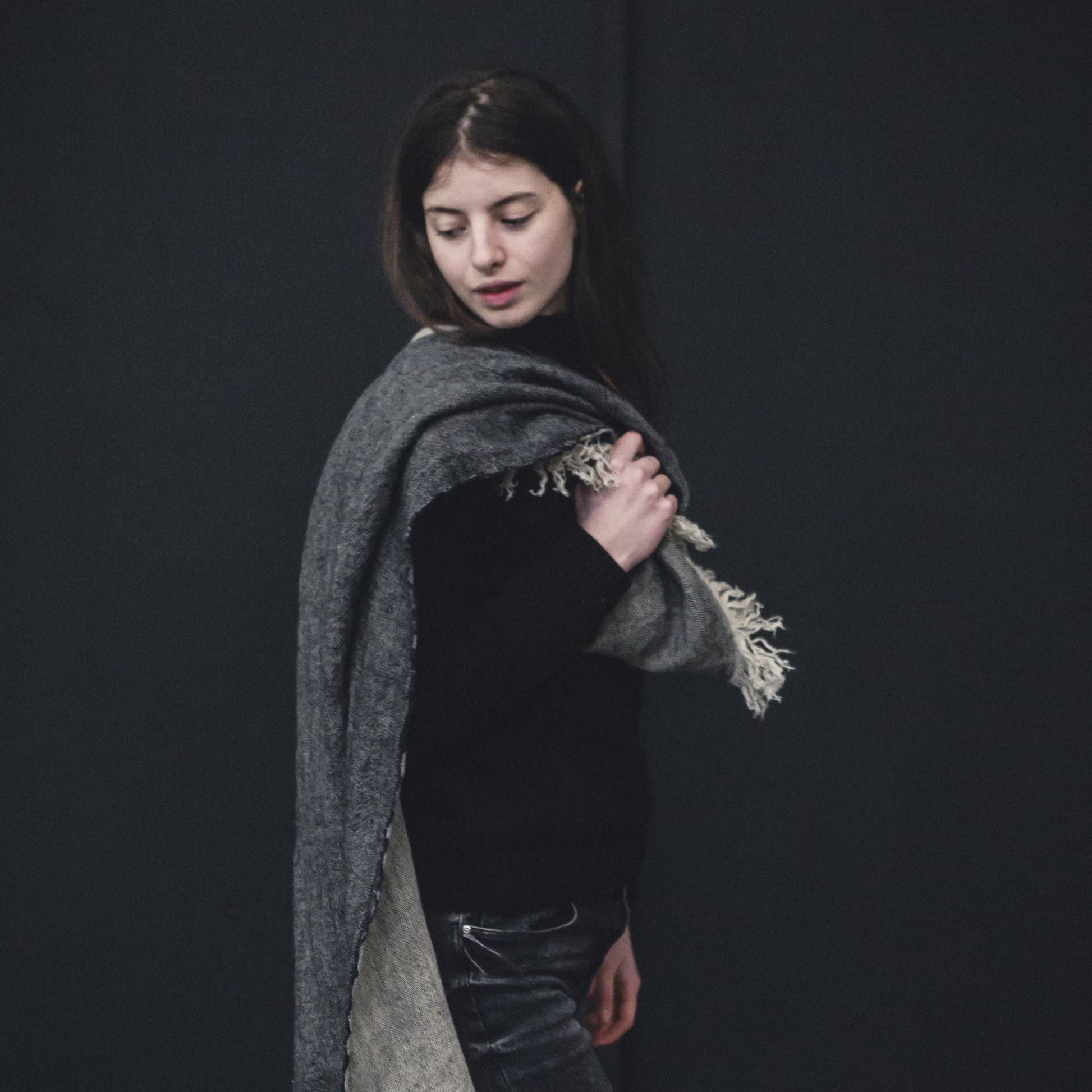 Woman holding Libeco The Belgian Towel Fouta in Tack Stripe