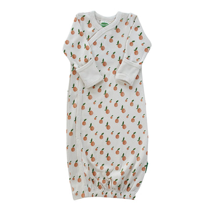 Baby onsie with citrus pattern on a white background