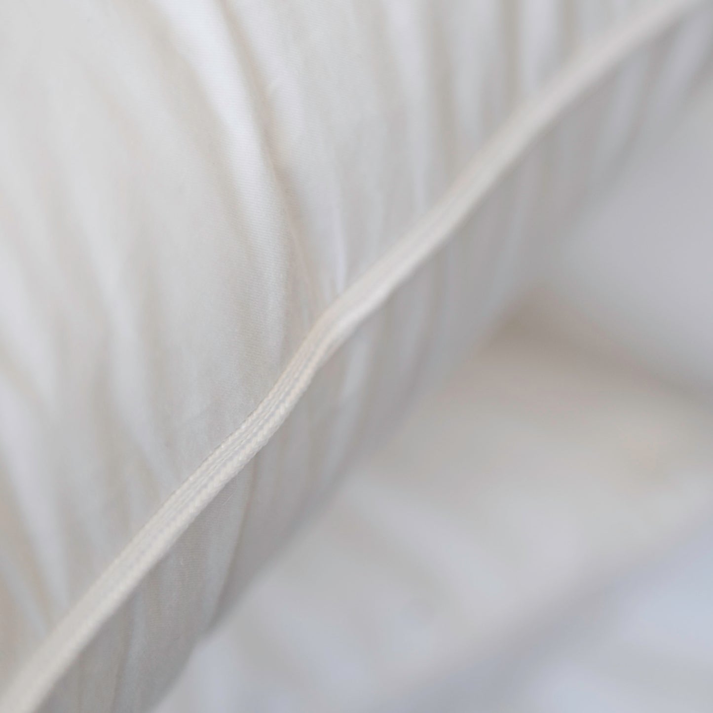 Close-up of St Geneve Heirloom Pillow with visible stitching details.