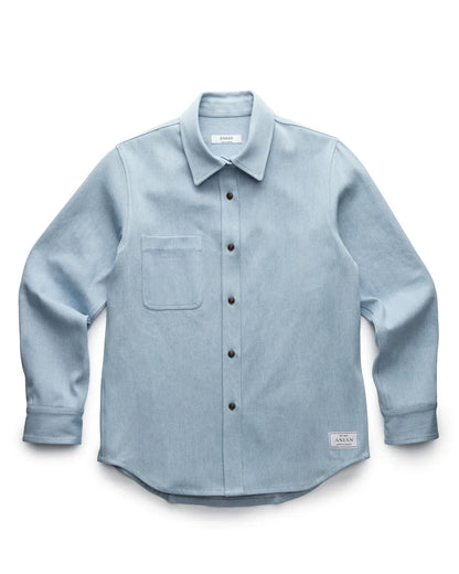LIGHT BLUE DENIM SHIRT PRODUCT SHOT, LAID FLAT WITH WHITE BACKGROUND