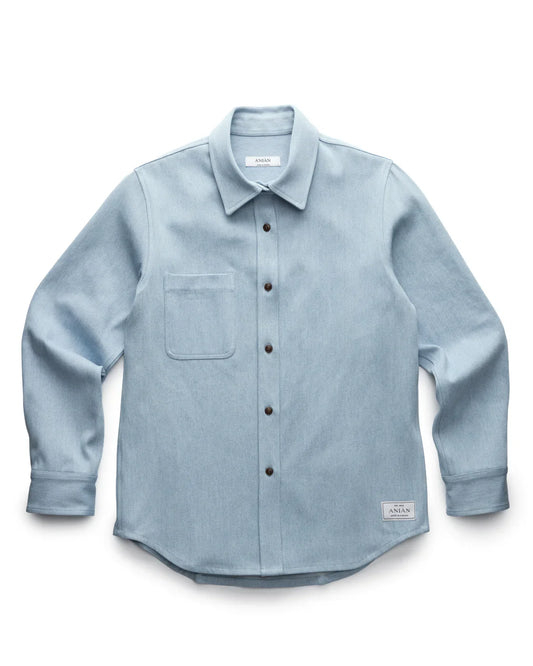 LIGHT BLUE DENIM SHIRT PRODUCT SHOT, LAID FLAT WITH WHITE BACKGROUND