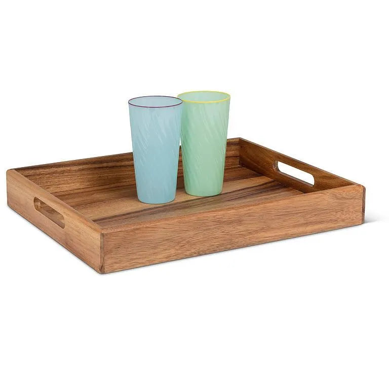 Wooden tray with two glasses on a white background