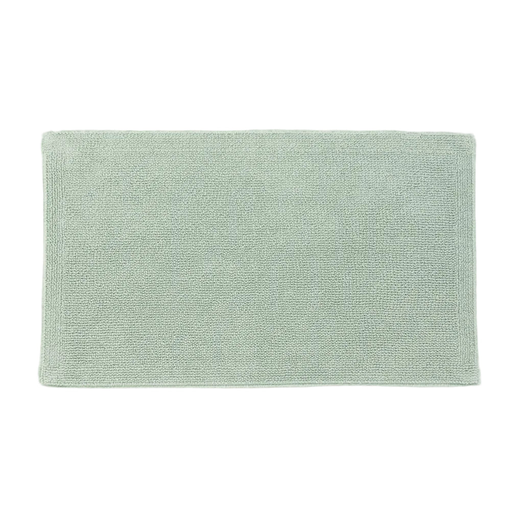 Green bath mat on a white background