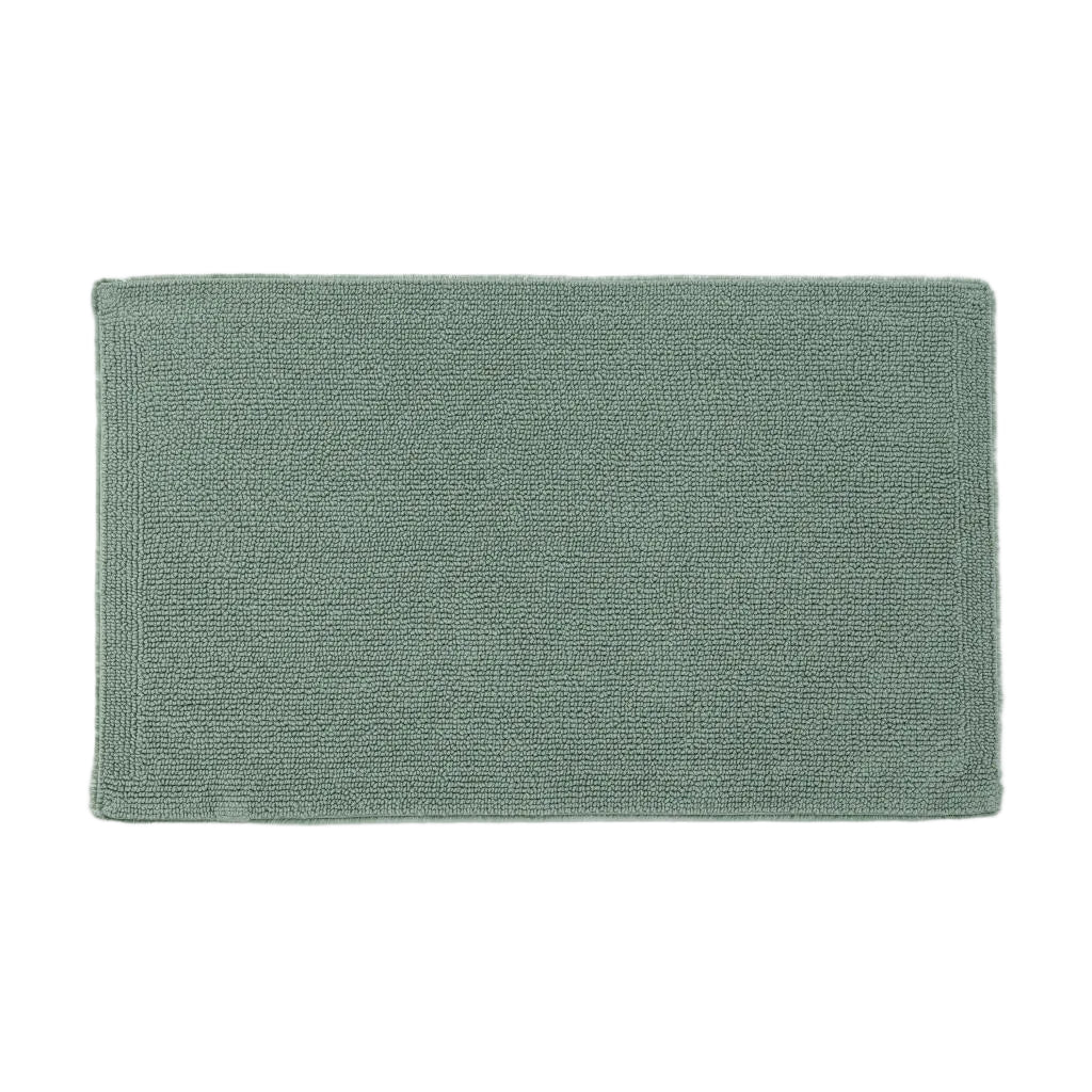Green bath mat on a white background
