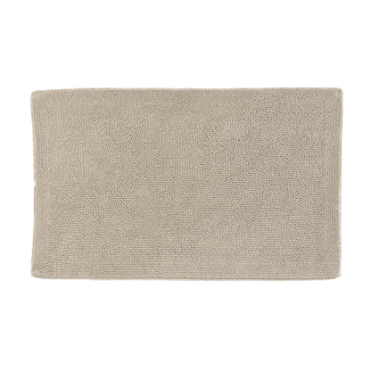 Beige bath mat on a white background