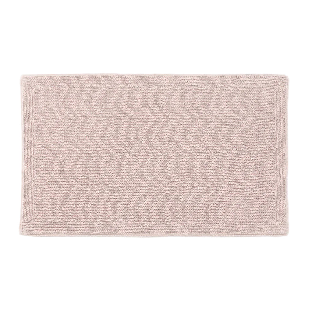 Light pink bath mat on a white background