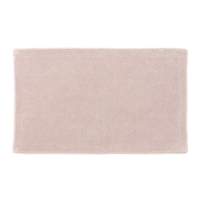 Light pink bath mat on a white background