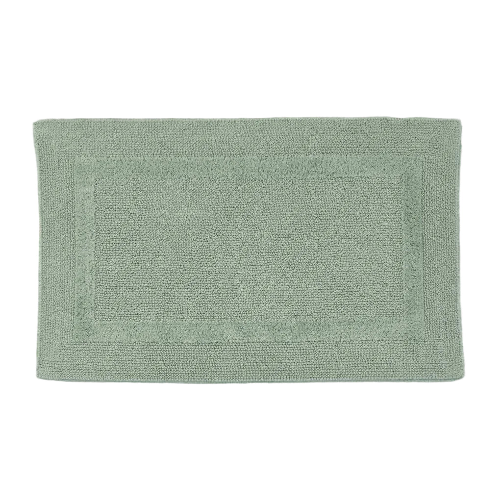 Green bath mat on a white background