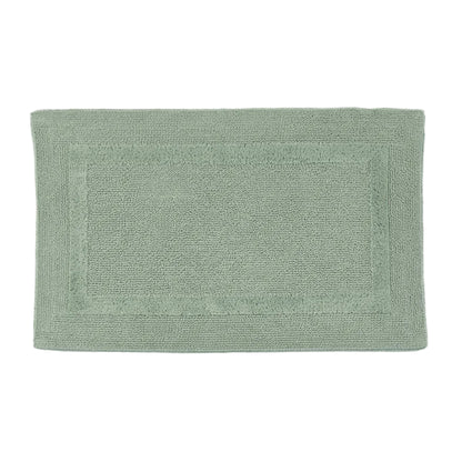 Green bath mat on a white background