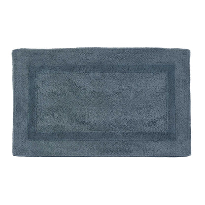 Rectangular blue bath mat on a light gray background