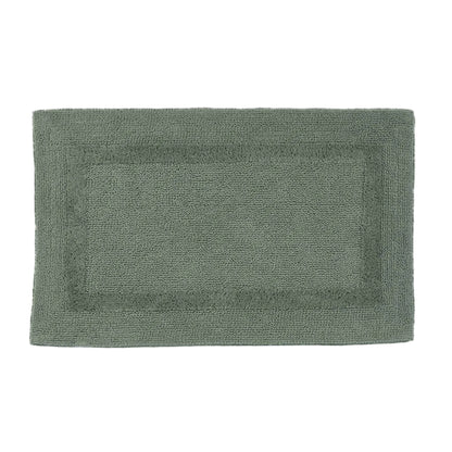Green bath mat on a white background