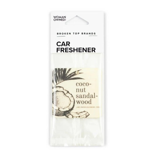 Car freshener packaging with coconut sandalwood scent on a white background