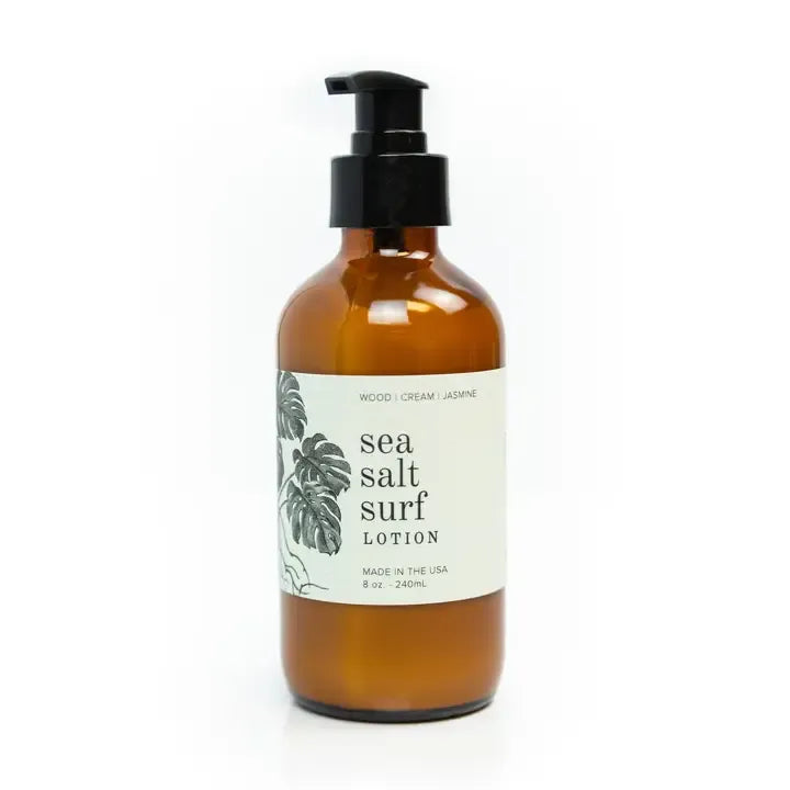 Hand & body lotion in an amber pump bottle, labelled sea salt surf. 