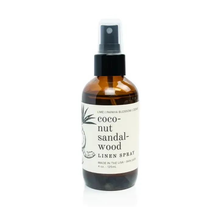 Coconut sandalwood linen spray bottle on a white background