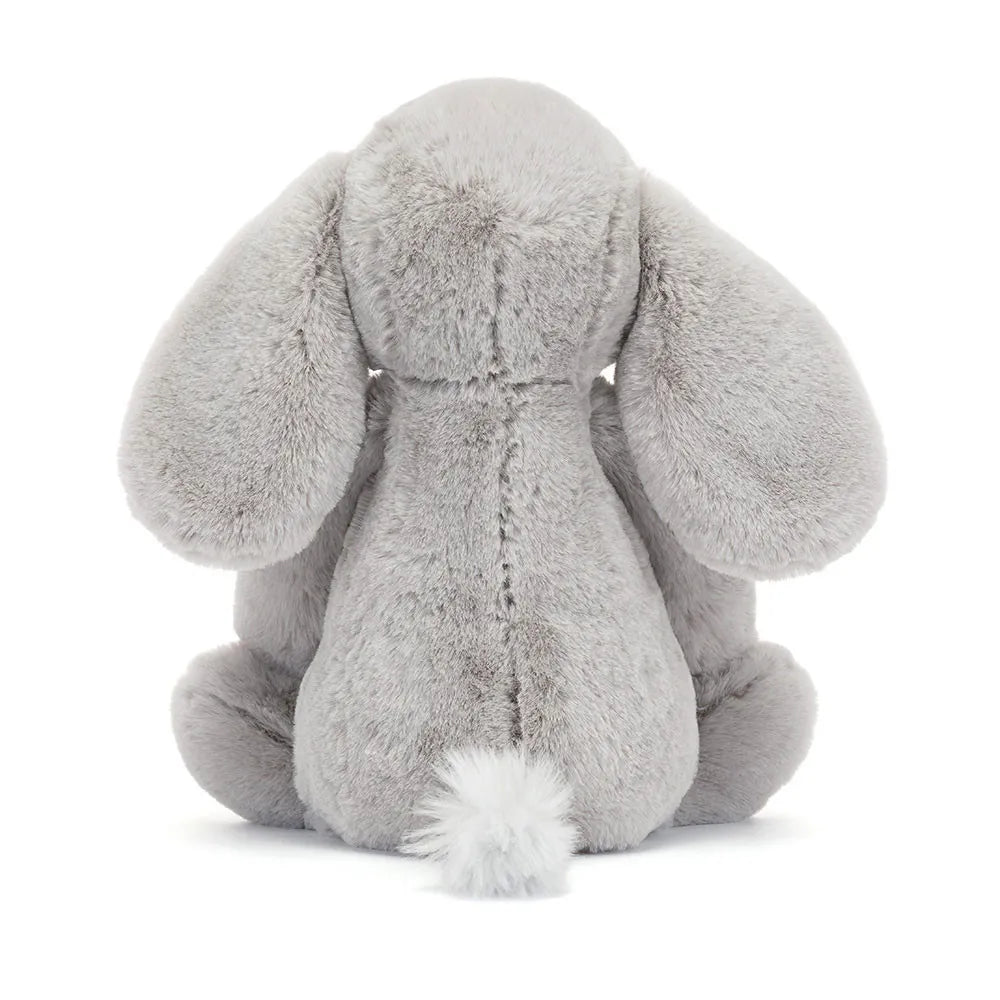 Gray plush elephant toy on a white background