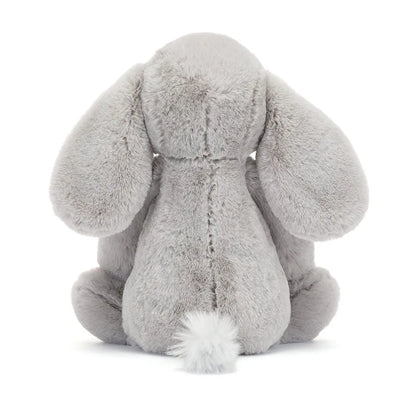 Gray plush elephant toy on a white background