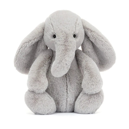 Plush elephant toy on a white background