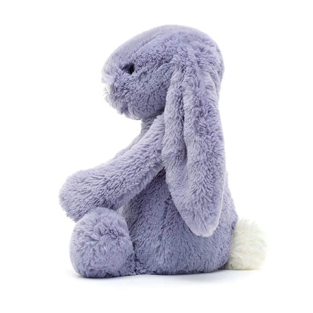 Plush toy rabbit in purple on a white background