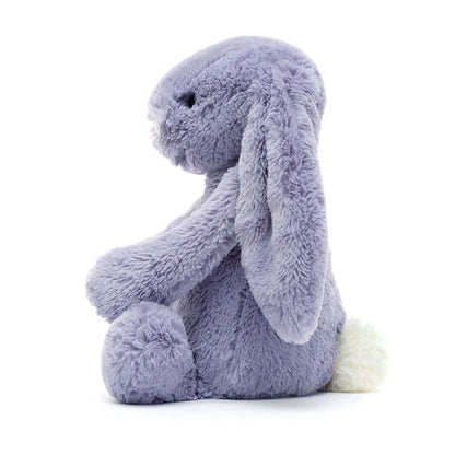 Plush toy rabbit in purple on a white background