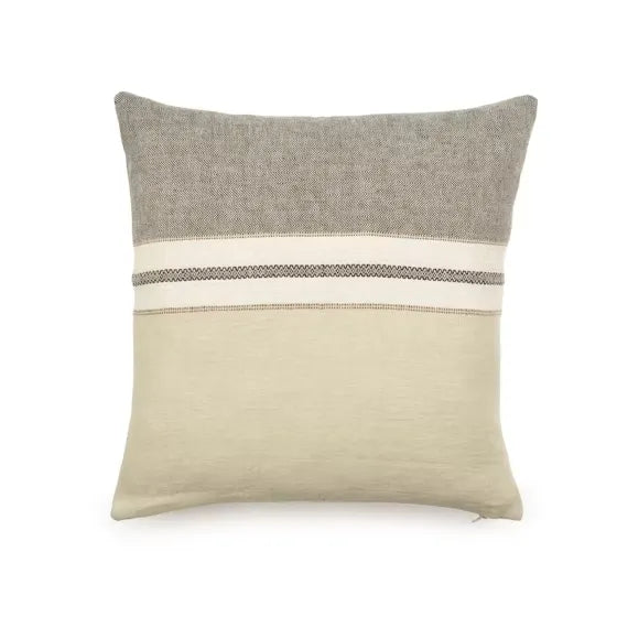 A square throw pillow in a textured linen-like fabric, featuring a two-tone design with a gray top half and a warm beige bottom half, divided by a horizontal stripe pattern band.
