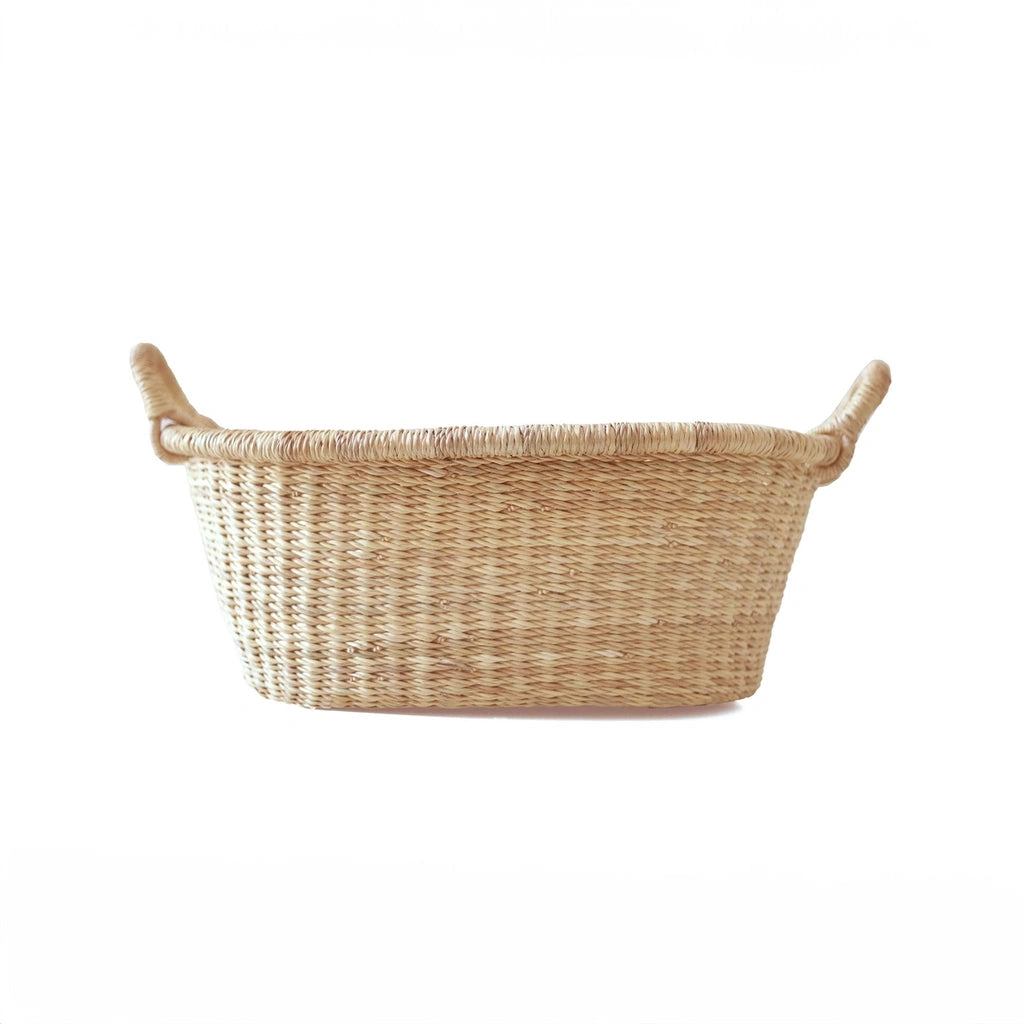 Natural woven basket on a white background