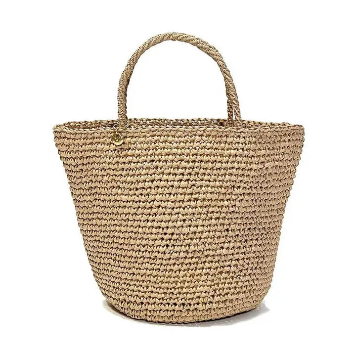 Woven straw tote bag on a white background