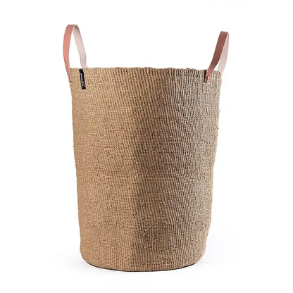 Beige woven laundry basket with leather handles on a white background