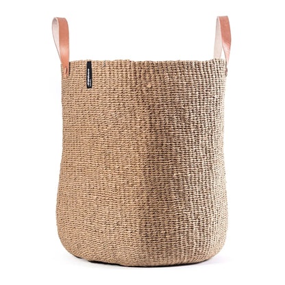 Woven basket with leather handles on a white background